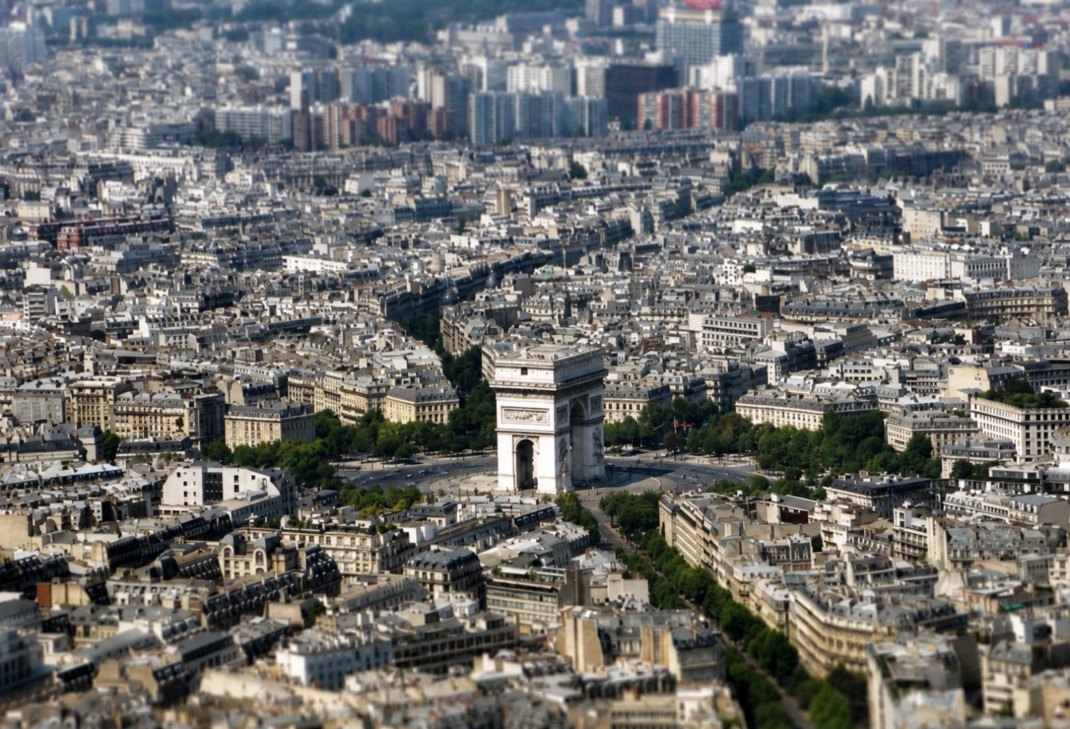 Aerial view across Paris with the Arc de Triomphe